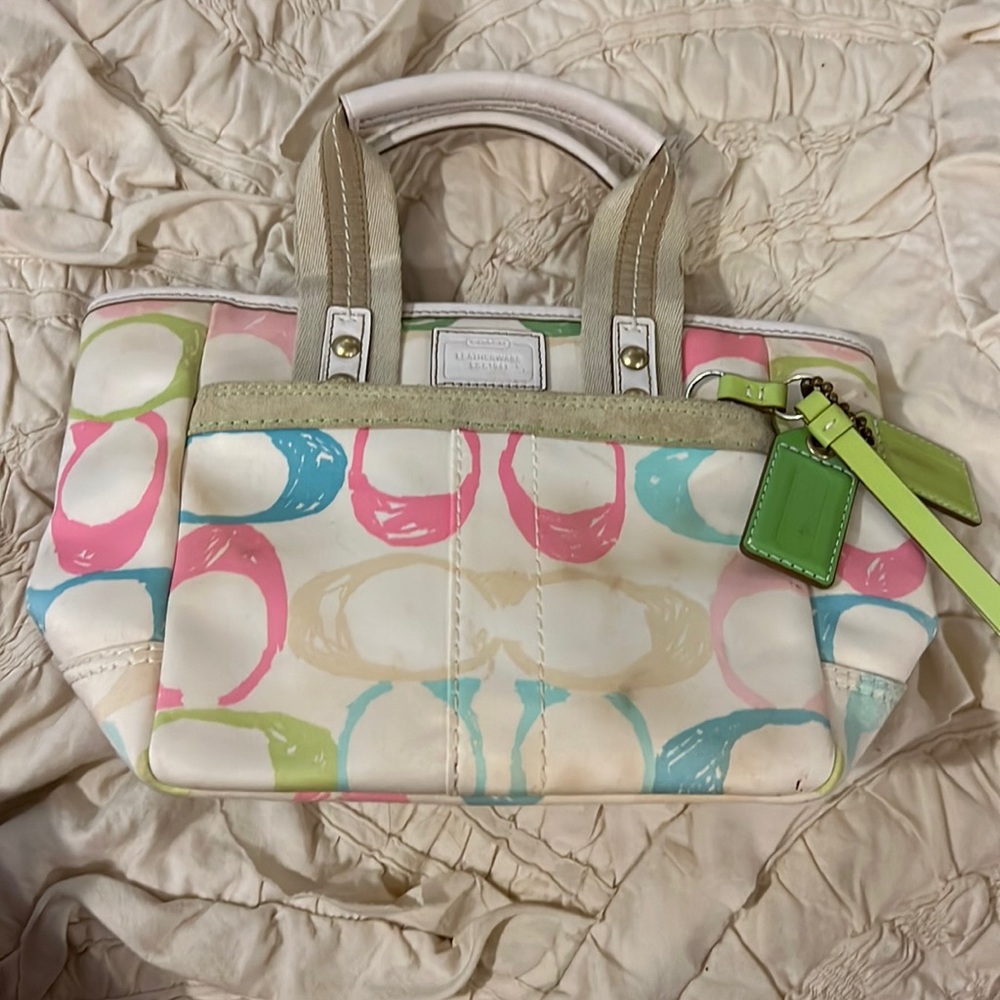 Coach small handbag with multicolored Cs.